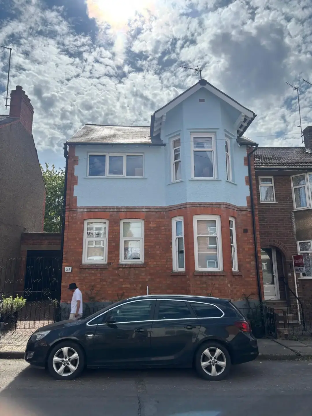 Bay-front exterior and blue door — After